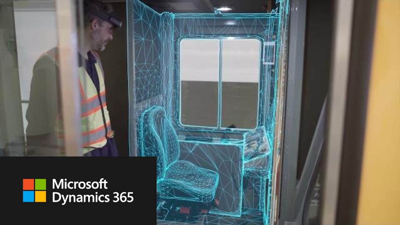 Still from the official Microsoft Dynamics 365 video showing Azure Object Anchors overlaying a wireframe mesh onto a physical cabin interior while a HoloLens user looks on.